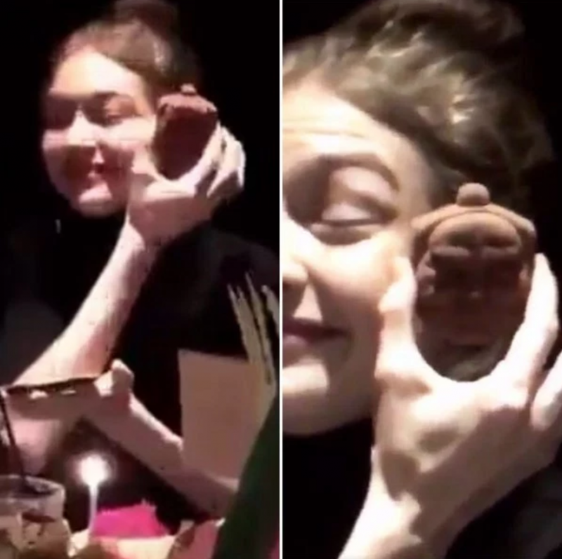 A still capture from a vidoe of Gigi Hadid posted by Bella Hadid to Instagram and SnapChat of Gigi posing with a Buddha Cookie